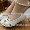 The pearl chain is low with white bridesmaid shoes and the wholesale bridal shoes are taken by the wholesale bride dress WS027