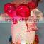 Holding a red heart acrylic snowman with LED Light