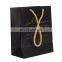 Black embossed gold logo paper shopping bag with handle