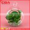 hanging glass candle holder shape with fake plant decor