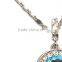 smaller crystals adorning necklace with the silver pendant