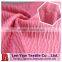 Polyester crinkle puckered fabric with wicking finish