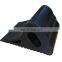 durable black rubber wheel chock stop block on road