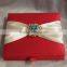 Hot sale elegant red silk hardcover wedding invitations with yellow ribbons&colorful crystal brooches                        
                                                Quality Choice