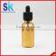 gold glass dropper bottle