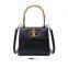 Hot-selling ostrich print manual small package ladies trapezoid bamboo-handle handbag