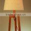 wholesale modern style wood tripod table lamp with barrel fabric lamp shade for hotel guest room decor