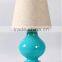 wholesale high end chrome round base glass table lamp with polished surface and barrel linen shade