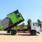 Hook arm garbage truck