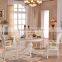 Durable dining room round marble table with wooden table base and chairs