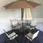 Patio Square Bar Dining Table with garden umbrella and folding chairs