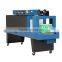 Automatic shrink wrapping machine