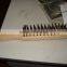 Steel wire brush with wooden handle