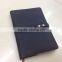 Notebook with button for closure