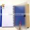 notebook with sticky notes and pen