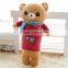 Soft plush bear toy with clothes and colorful scarf