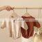 The new baby jumpsuit autumn cotton loose climbing clothes male baby romper bag fart clothes baby triangle jumpsuit