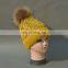 China Supplier Knitted Kids Caps with Raccoon Fur Pompoms Fleeces Hats