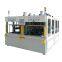 Double-station hot riveting machine for automotive door panels