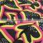 export surplus garments in delhi red yellow heart pattern on black polyester milk fiber Spandex Fabric