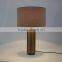 0627-12 antique brass-finished base and natural linen shade Straight and narrow Antique Brass Pillar Table Lamp