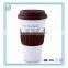 Hot sale ceramic travel mug with silicone lid and sleeve