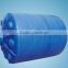 Storage tanks and white chemical plastic drums