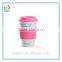 White porcelain travel coffee mug with silicone lid and sleeve in color