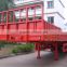 Shandong trailer factory manufacturers supply 3 axle twist lock container carrier side wall semi trailer