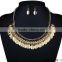 Gorgeous oval gold disc chain with crystal necklace with matching earrings