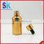 gold glass dropper bottle