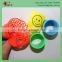 Small plastic slinky toy with smiling face