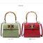 Hot-selling ostrich print manual small package ladies trapezoid bamboo-handle handbag