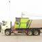 Hook arm garbage truck
