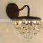 0108-13 CRYSTAL Clear glass droplets sparkle in the light cast by this bronze-finished sconce