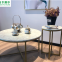 Gold metal X-base round marble top coffee tables