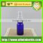 blue glass bottle with plastic spray cap for cosmetic packing