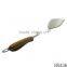 Professional stainless steel cooking spatula with wood handle