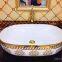 Hot sale ceramic round modern luxury golden single hole wash basin price bathroom basin with gold decorative