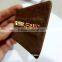 camel color jeans leather label/metal plate in the middle