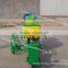 One row walking corn planter by tractor