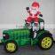 Christmas inflatable santa on farming tractor