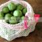Reusable compostable cotton muslin veggie or fruit storage bag for produce