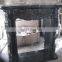 carved black granite fireplace surround,stone fireplace