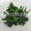 Artificial holly plant branch with red berries for xmas decoration