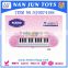 Pink plastic musical toy piano for kids