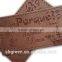 Dark brown irregular false leather label for pants