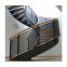 curved stainless steel staircase with glass balustrade