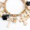 multiple charms cross peace bracelet