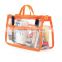 Orange PVC make-up bag with webbing